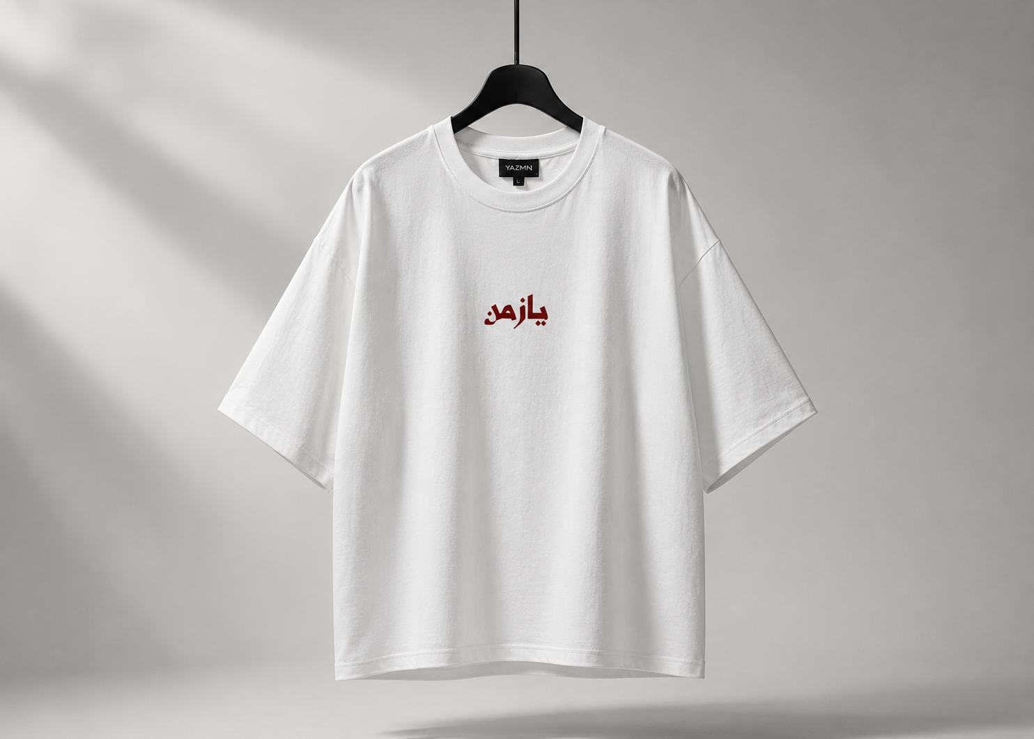 YAZMN white t-shirt front view on hanger